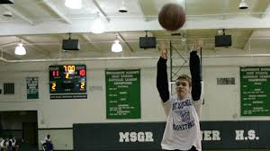 The packed gym goes silent,