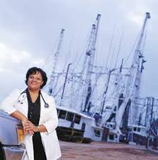 Regina Benjamin in front of shrimp 